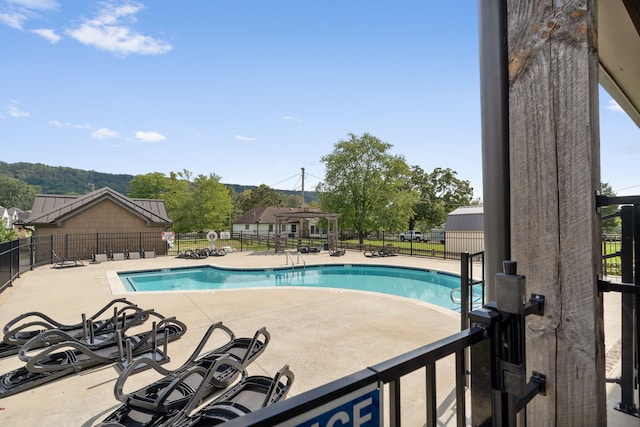 view of swimming pool featuring a patio area