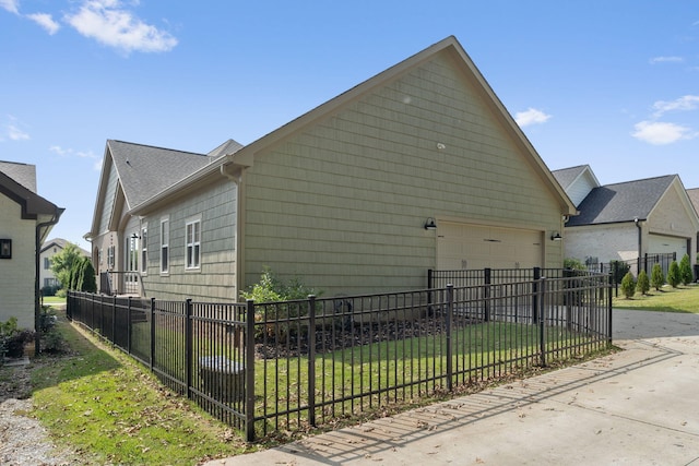 view of home's exterior with a lawn and a garage