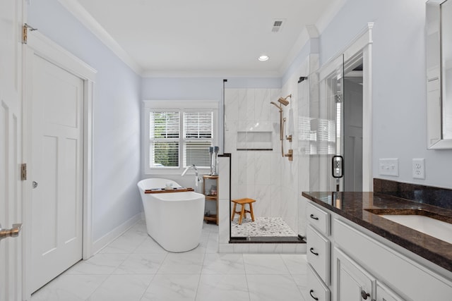 bathroom with vanity, crown molding, and separate shower and tub