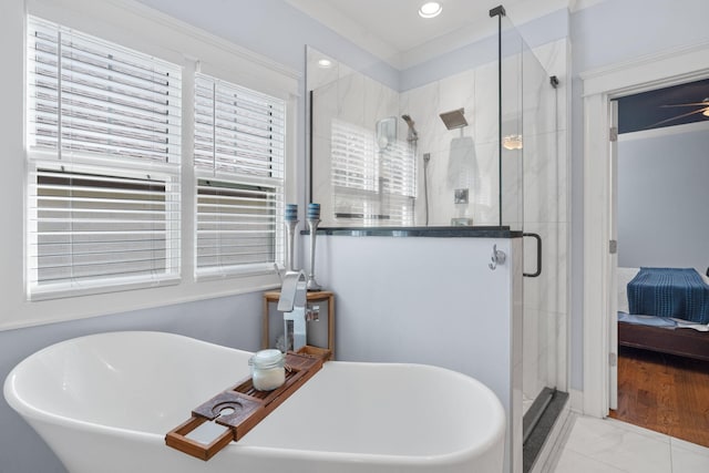 bathroom featuring separate shower and tub, hardwood / wood-style floors, sink, and ceiling fan