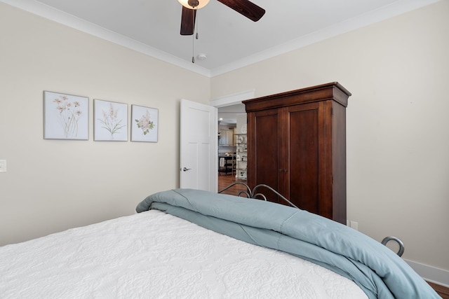 bedroom with crown molding and ceiling fan