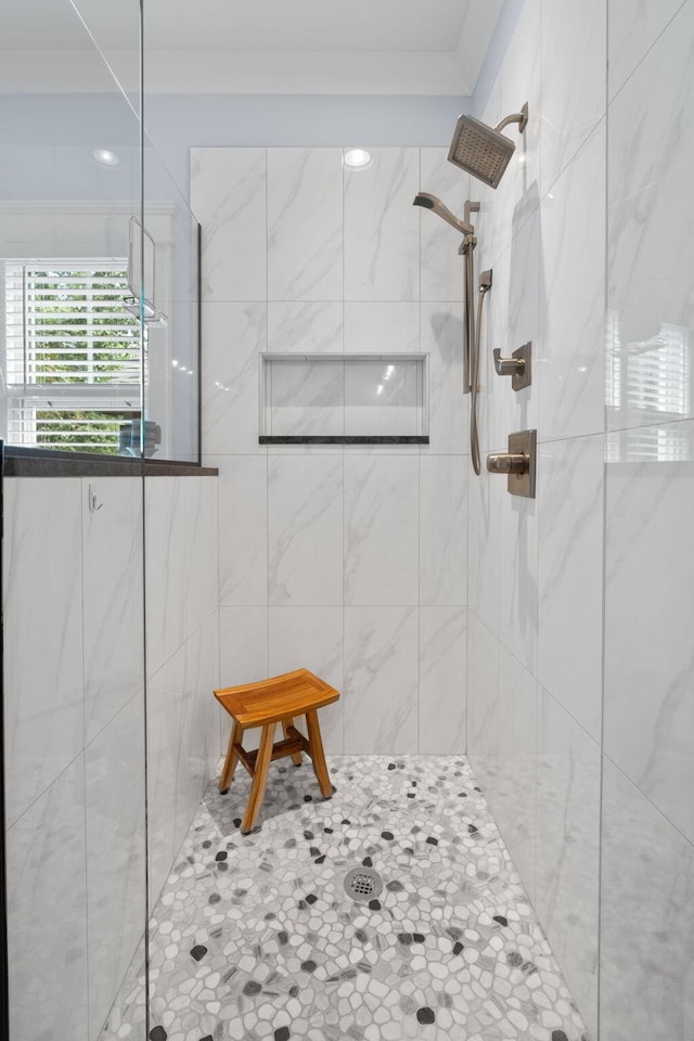 bathroom with a tile shower