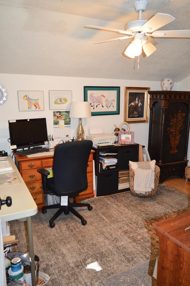 home office with hardwood / wood-style flooring, a textured ceiling, and ceiling fan