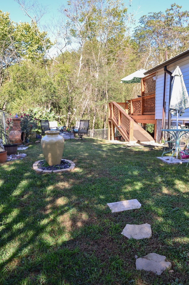 view of yard with a deck