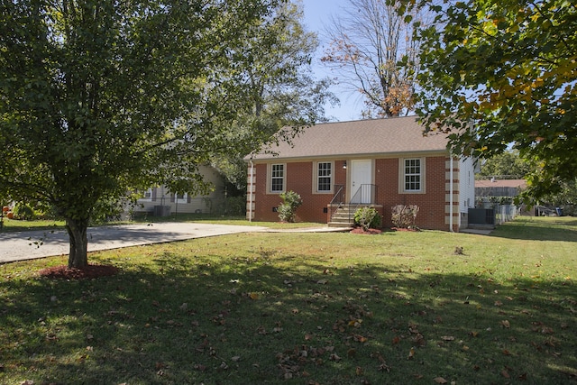 ranch-style home with a front lawn