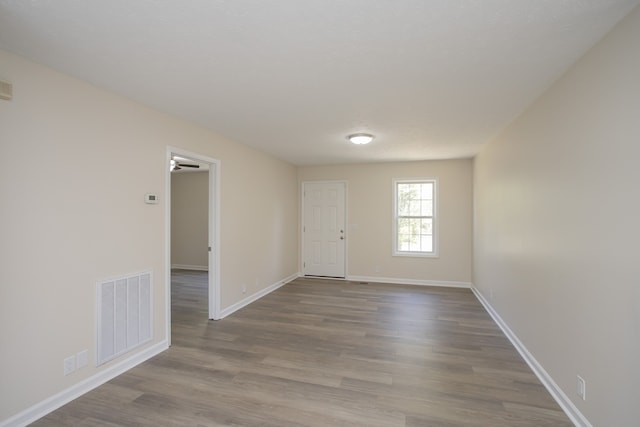 unfurnished room featuring wood-type flooring