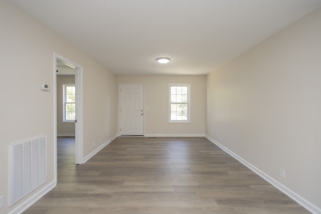 interior space featuring hardwood / wood-style flooring and a healthy amount of sunlight