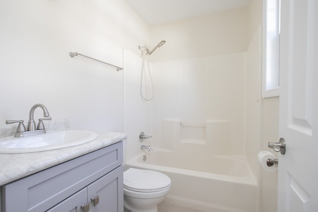 full bathroom featuring vanity, shower / bath combination, and toilet