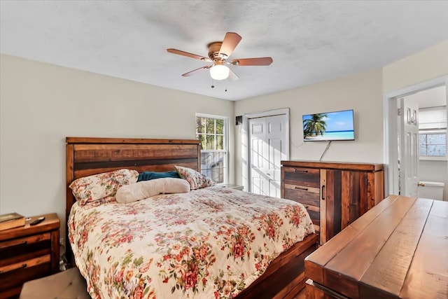 bedroom featuring multiple windows, a closet, and ceiling fan