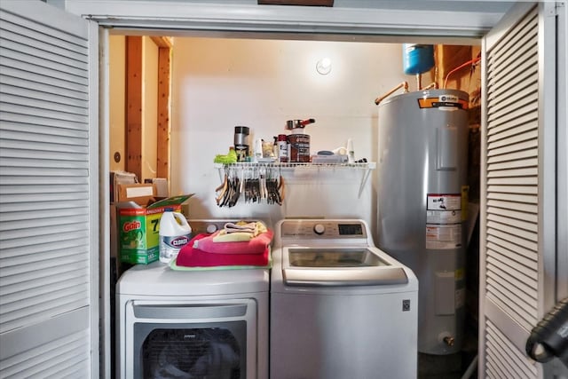 washroom featuring washer and clothes dryer and water heater