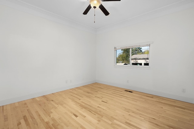 unfurnished room with light hardwood / wood-style floors, ornamental molding, and ceiling fan