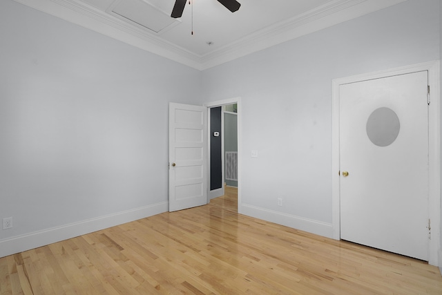 spare room featuring light hardwood / wood-style floors, ornamental molding, and ceiling fan