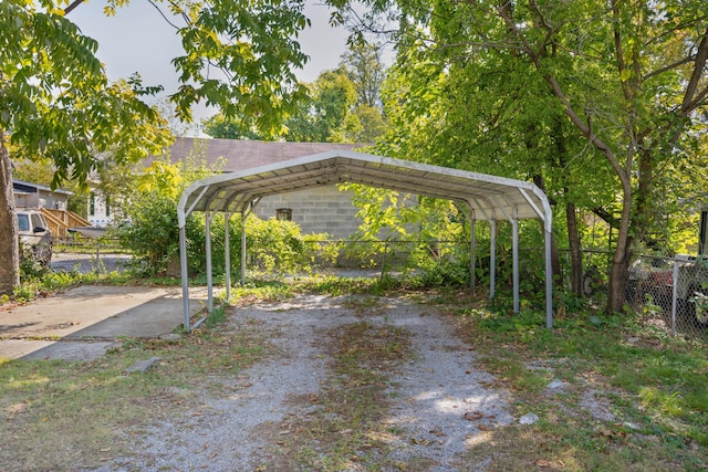 view of vehicle parking featuring a carport