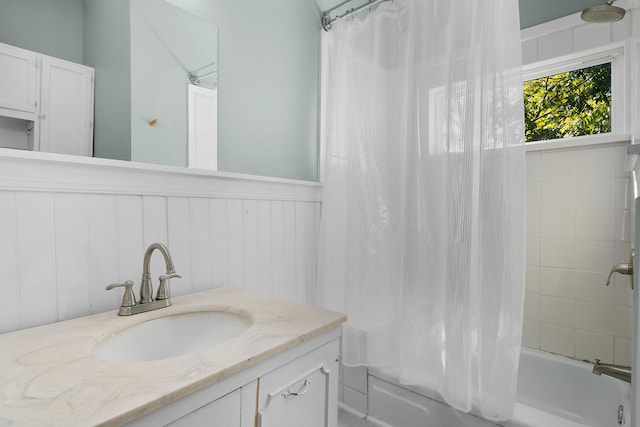 bathroom with vanity and shower / bath combo