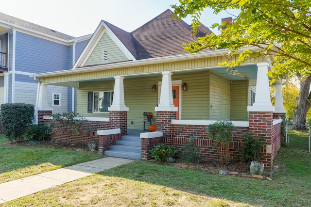 view of front facade with a porch and a front lawn