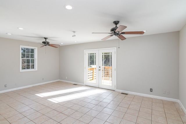 unfurnished room with french doors, ceiling fan, and light tile patterned flooring