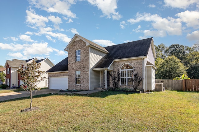 view of front property with a garage and a front lawn