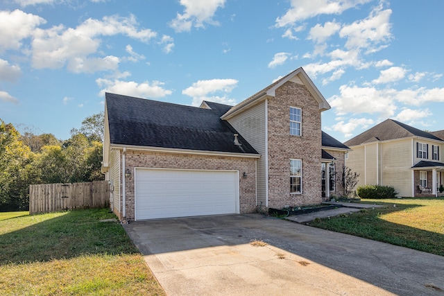 front of property featuring a front lawn and a garage