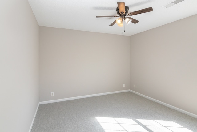 empty room featuring light colored carpet and ceiling fan