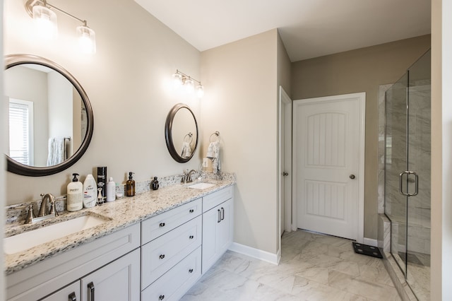 bathroom featuring vanity and an enclosed shower