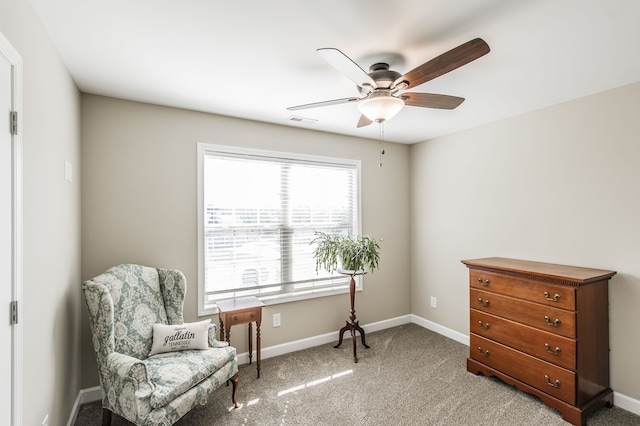 sitting room with carpet and ceiling fan