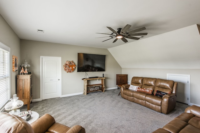 carpeted living room with vaulted ceiling and ceiling fan