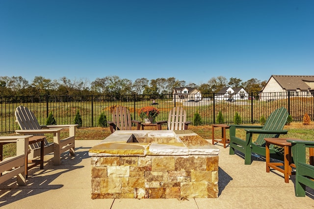 view of patio featuring a fire pit