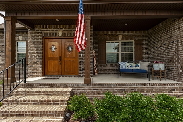 property entrance with covered porch