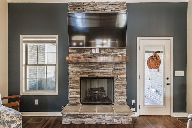 interior details with a fireplace and hardwood / wood-style floors