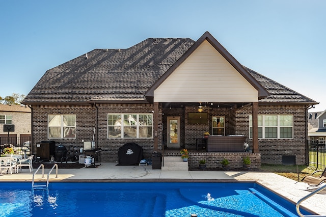 back of house with a patio and a fenced in pool