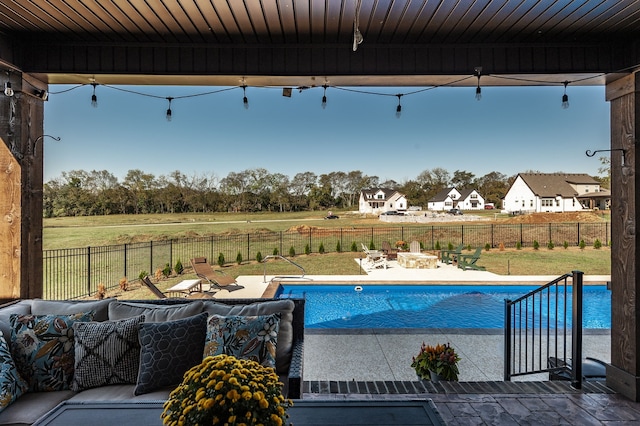 view of pool featuring a patio and a lawn