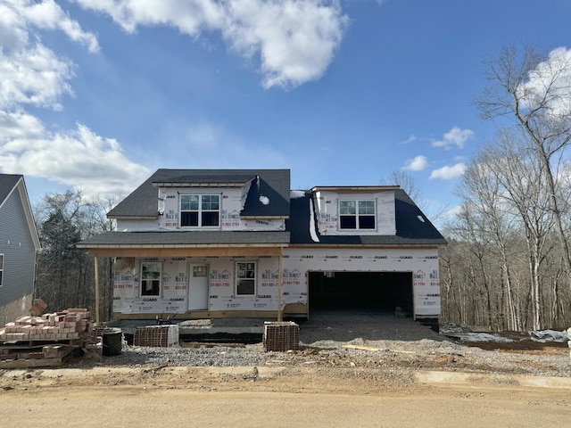 property in mid-construction featuring a porch, a garage, and central AC unit