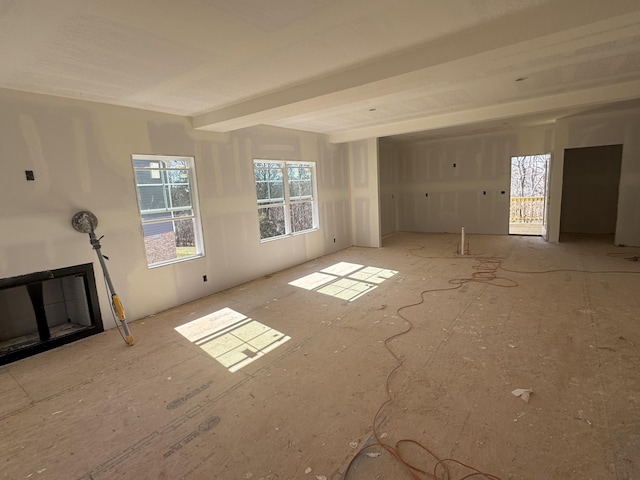 spare room with a glass covered fireplace