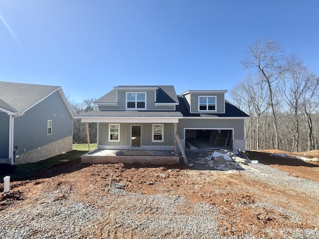 view of front of home featuring a garage and covered porch