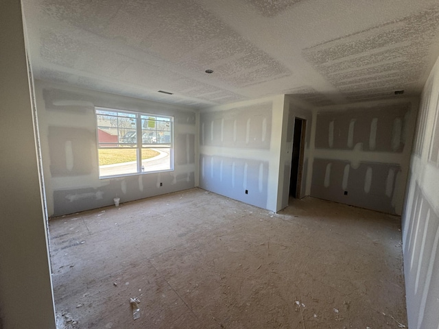 empty room featuring a textured ceiling