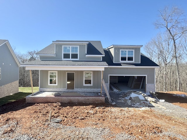 view of front of home with a garage and covered porch