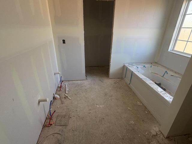 bathroom featuring a garden tub