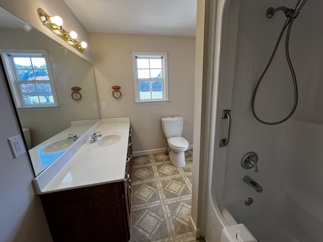 full bathroom with toilet, vanity, and bathing tub / shower combination