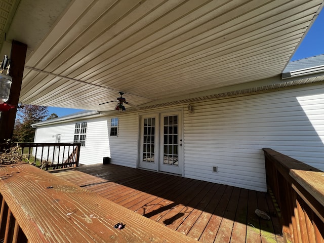 wooden deck featuring ceiling fan