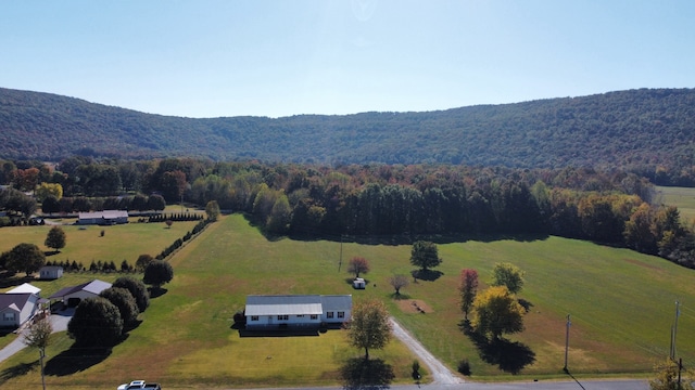 birds eye view of property with a mountain view and a rural view