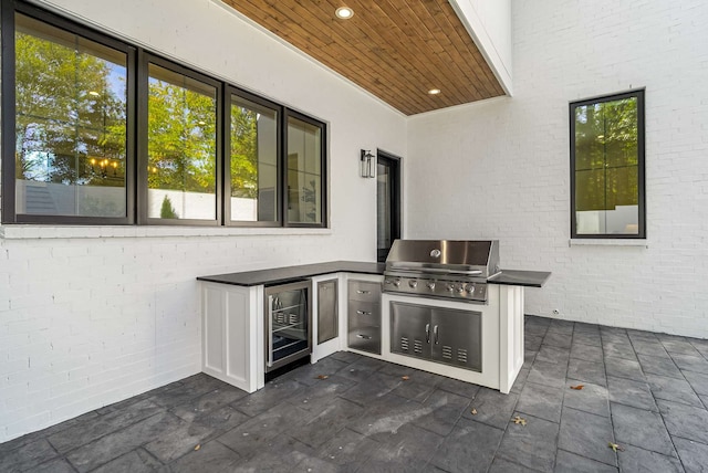 view of patio / terrace with area for grilling and wine cooler