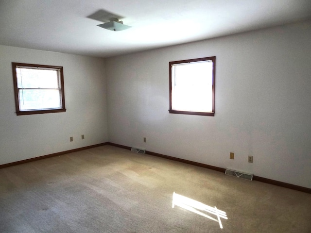 empty room featuring carpet flooring