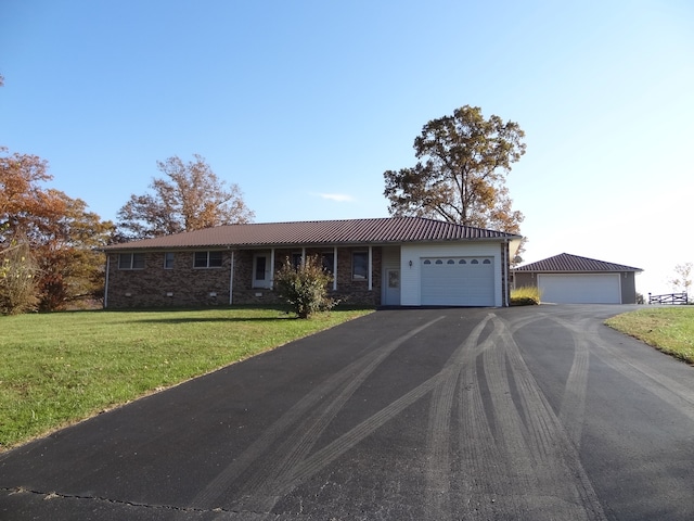 ranch-style house with a front yard and a garage