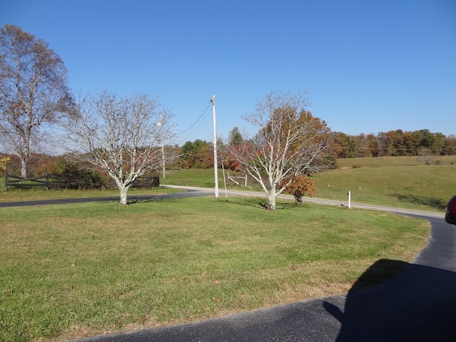 view of yard with a rural view