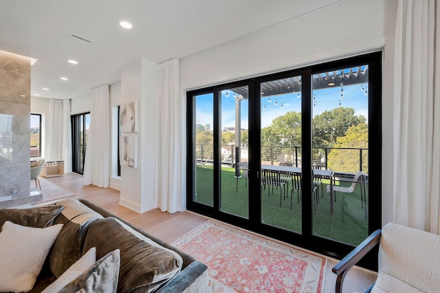 doorway to outside with light hardwood / wood-style flooring