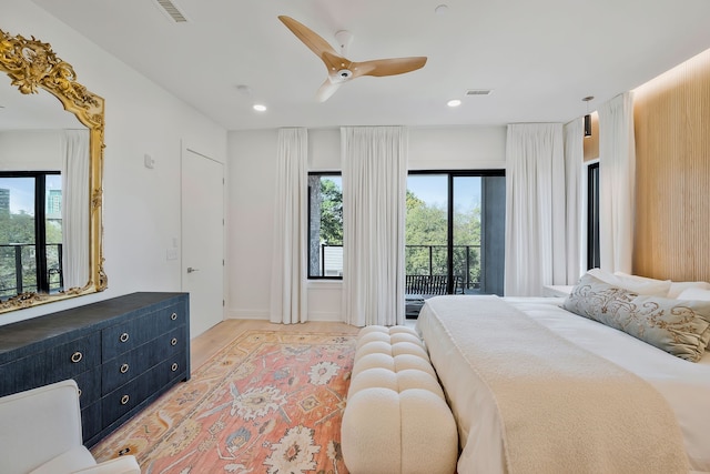 bedroom with ceiling fan, light hardwood / wood-style floors, and access to outside