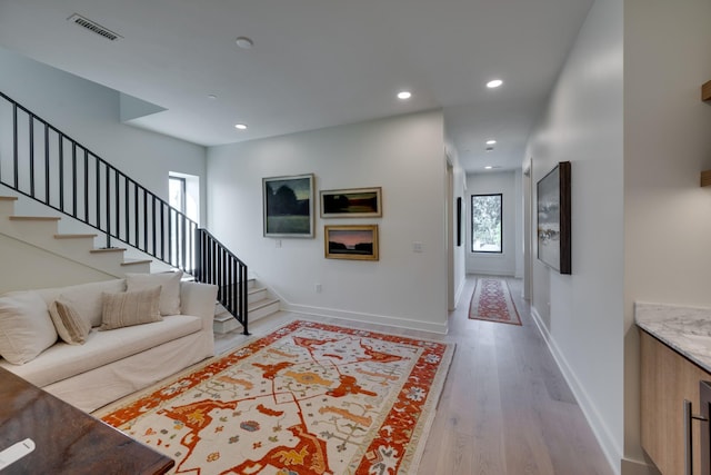 interior space featuring light hardwood / wood-style floors and a healthy amount of sunlight