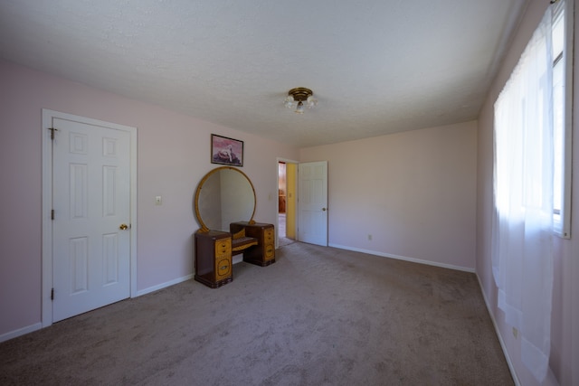 empty room with carpet flooring