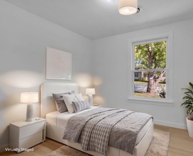 bedroom with light hardwood / wood-style floors