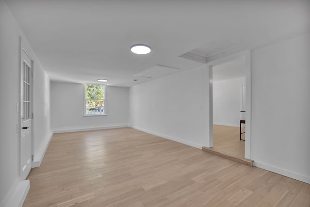 empty room with light hardwood / wood-style flooring